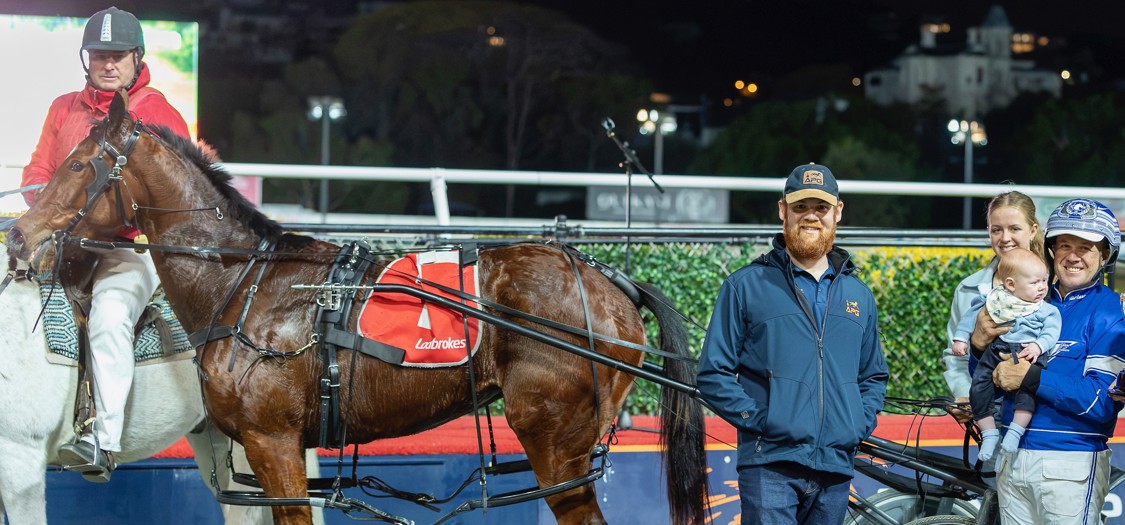 Trainer and driver Shane Graham with son Jackson and other connections after Saturday's win.