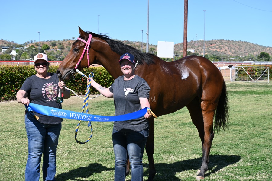 Holly-Marie Robertson with jockey James Baker and gelding Mishani Eagle at Buchanan Park after her first win in 2024.