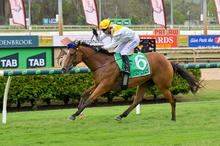 Jason Morgan and jockey Raul Silvera Olivera with connections of Remember The Boys. Pictures: Caught in the Act Photography CQ.